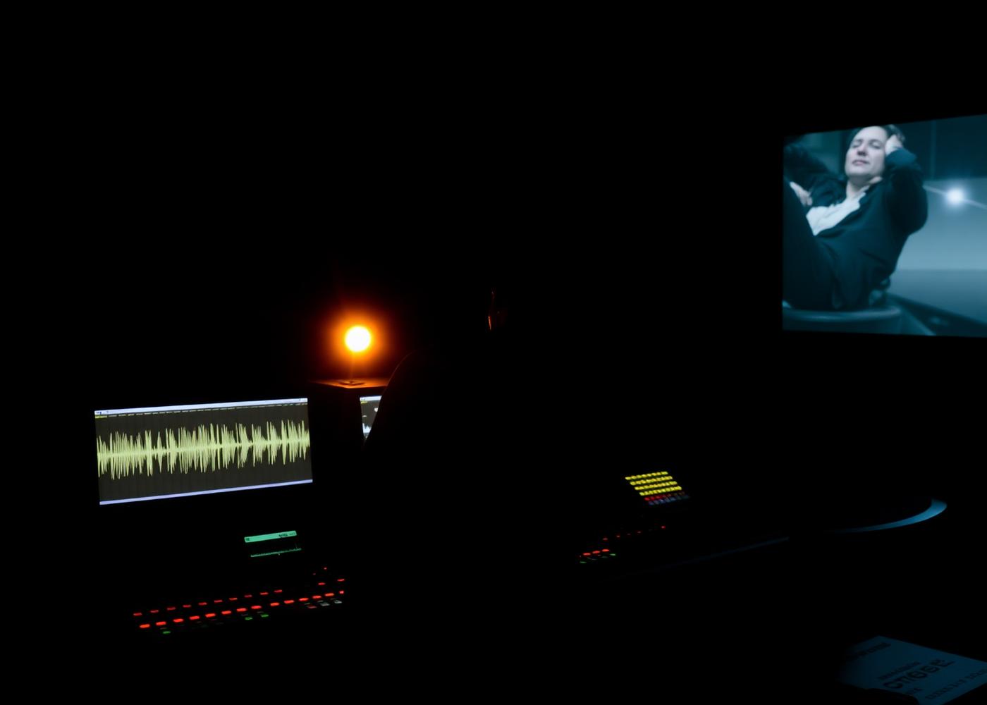 Audio engineer at a mastering console